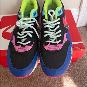 Nike Kids Black Sneakers with Blue, Pink & Neon Green Accents